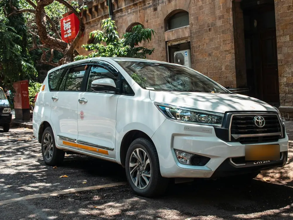 White Toyota Innova Crysta with Indian plates
